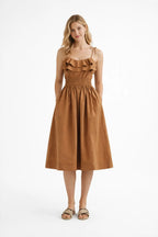 Woman wearing a brown dress on a white background